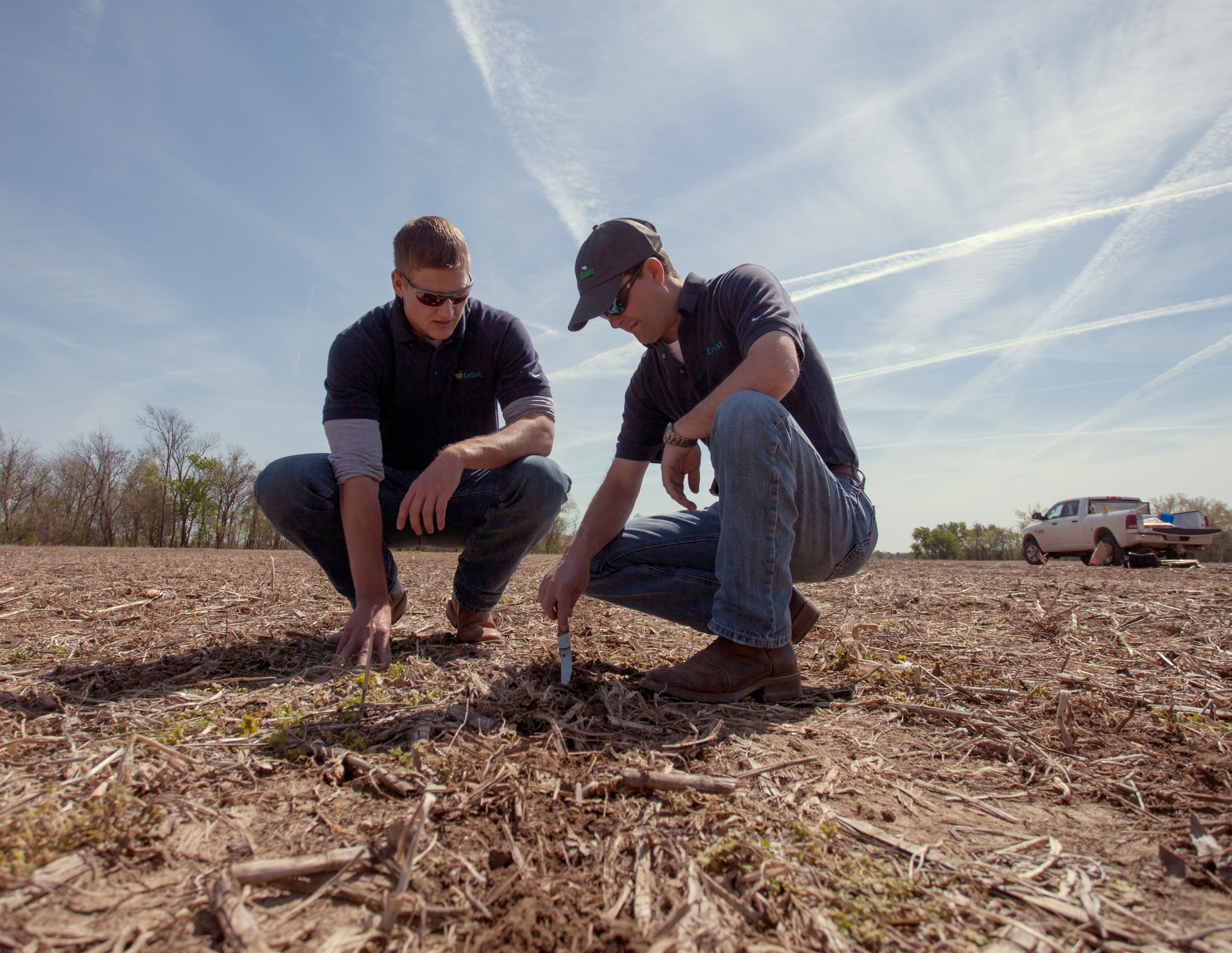 Farmers examining burndown